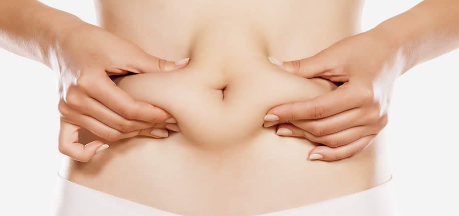 woman squeezing abdominal fat